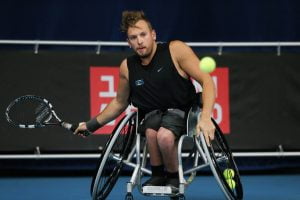 An image of Dylan Alcott in action during wheelchair tennis