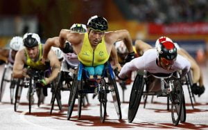 An image of Kurt Fearnley participating in athletics with other parathletes