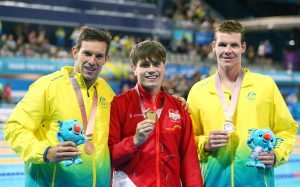 An image of Liam Schluter, Daniel fox and Michael Dodge holding their medals