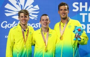 An image of Timothy Hodge, Timothy Disken and Blake Cochrane smiling with their medals