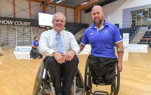 An image of Scott Morrison with a para-athlete. Both are sitting on wheelchairs.