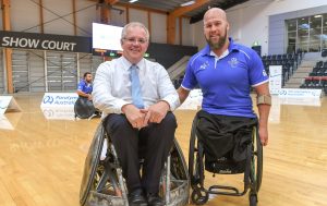 An image of Scott Morrison with a para-athlete. Both are sitting on wheelchairs.
