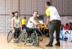 An image of para-athletes during a game of wheelchair basketball