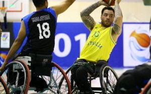 An image of a para-athlete in a match of wheelchair basketball