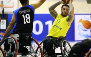 An image of a para-athlete in a match of wheelchair basketball