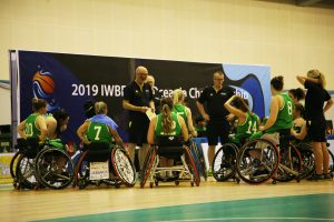 Image of a para-athlete team with coaches