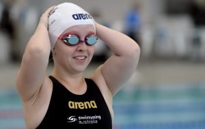 Image of a swimmer smiling in her swimming gear