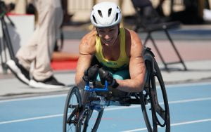Image of Eliza Ault Connell in action in a wheelchair race