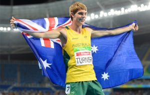 Image of James Turner holding Australian Flag