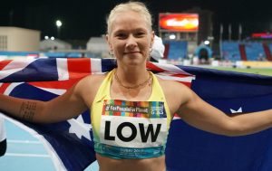 female paralympian smiling with Australian flag