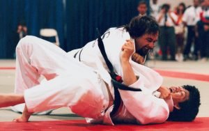 Image of male Paralympian Anthony Clarke in a Judo match with a competitor