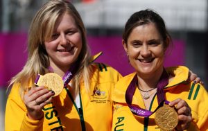 Paralympians Stephanie Morton and Felicity Johnson holding gold medals