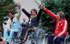 Barbara Caspers pictured middle, on the podium with her arms raised above her head
