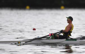 Australian Paralympian Erik Horrie rowing on the water