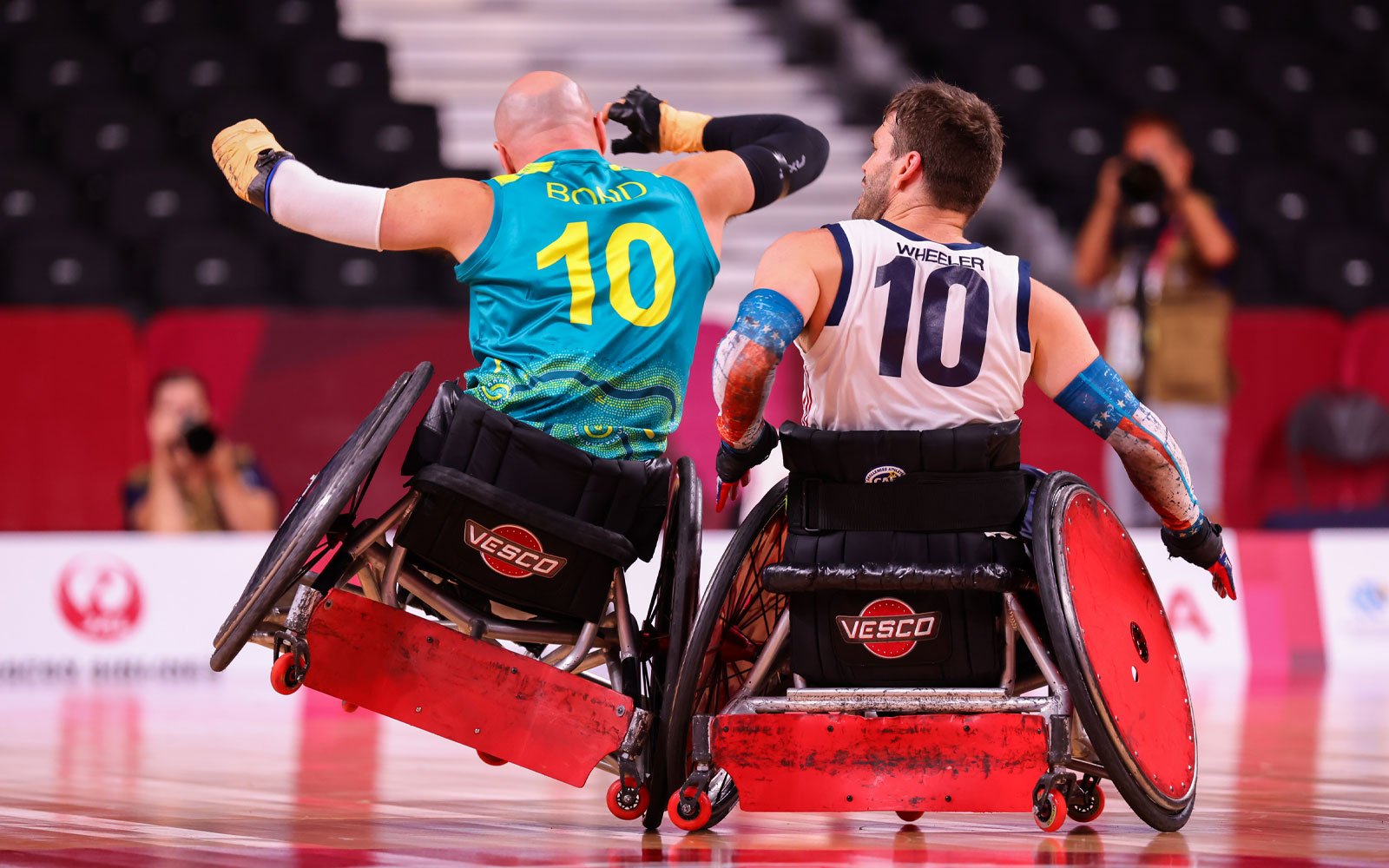 Two make wheelchair rugby players clash their chairs on court