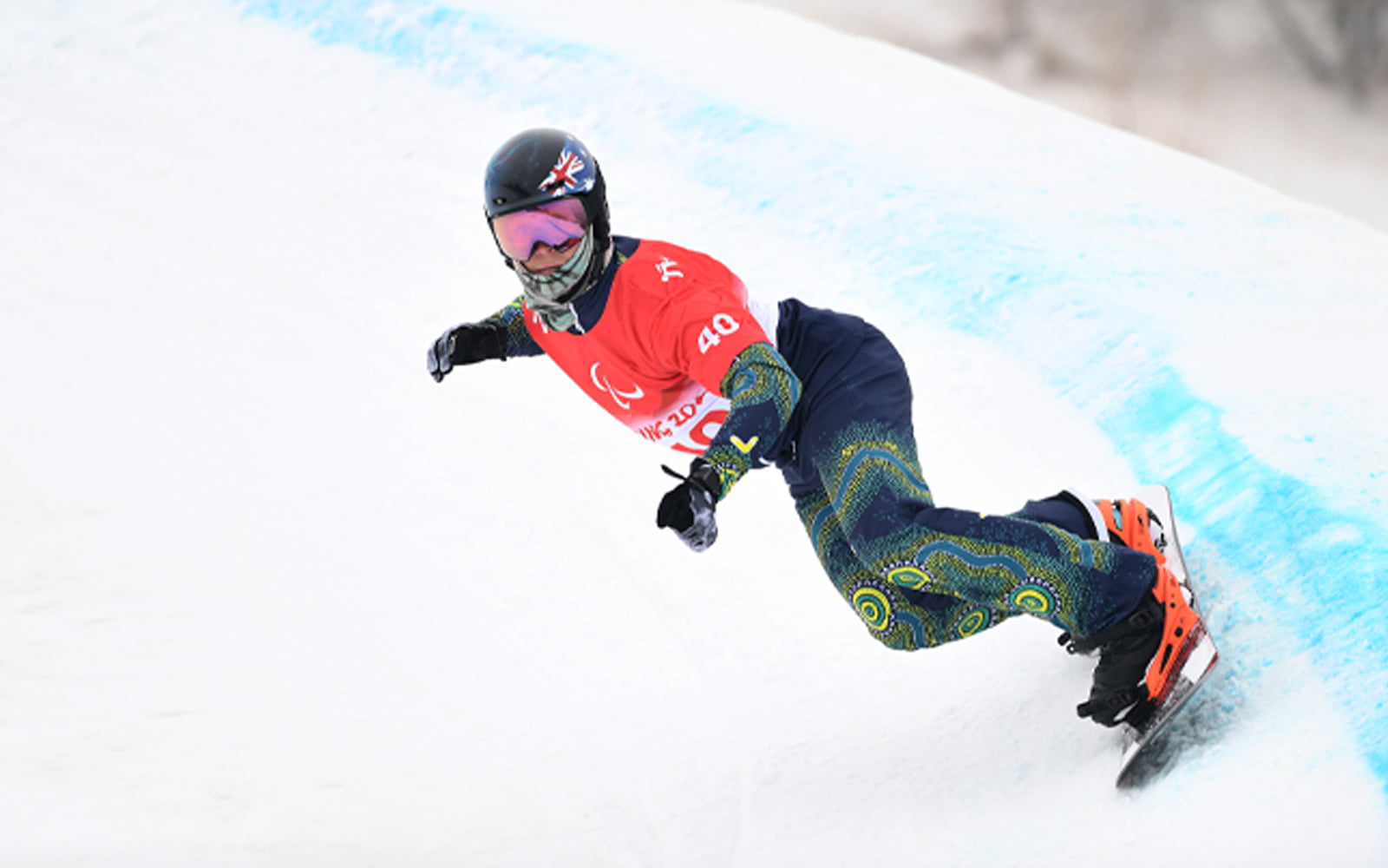 Australian Paralympian Ben Tudhope snowboarding the Banked Slalom at Beijing 2022