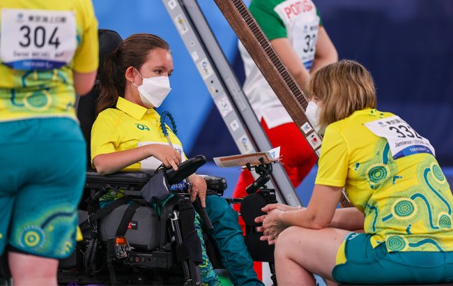 Australian Paralympian Jamieson Leeson and her ramp assistant