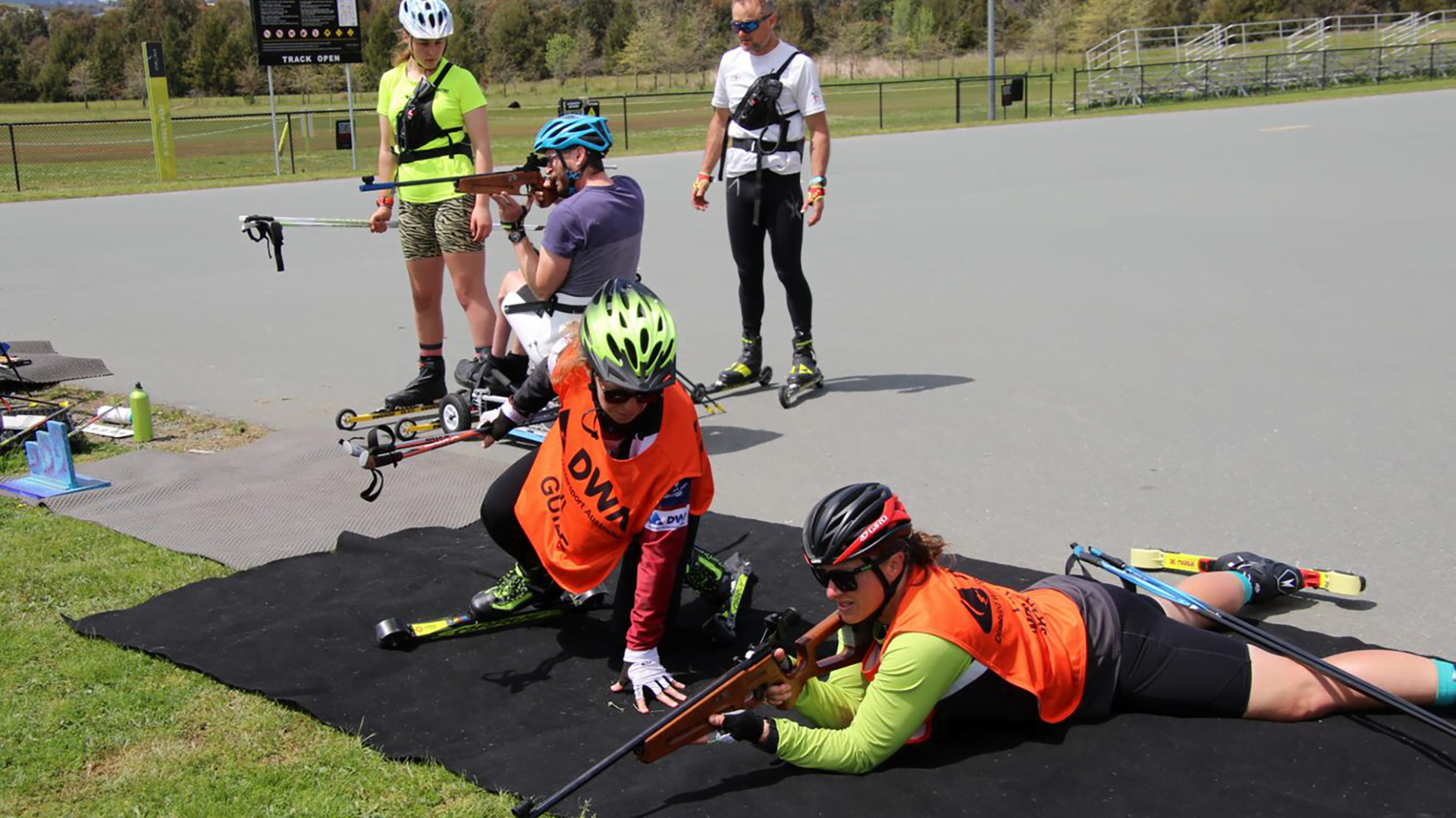 A group of people participating in Para-biathlon.