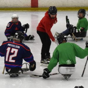 A game of Para-ice hockey.