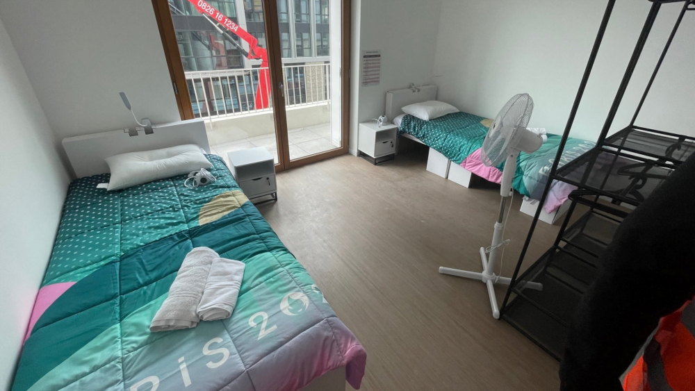 An example of a bedroom with two beds in the athlete's village in Paris.