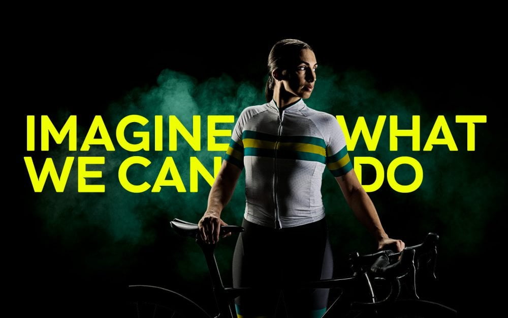 Australian Para-cyclist Paige Greco with her bike. Text reads: Imagine What We Can Do.